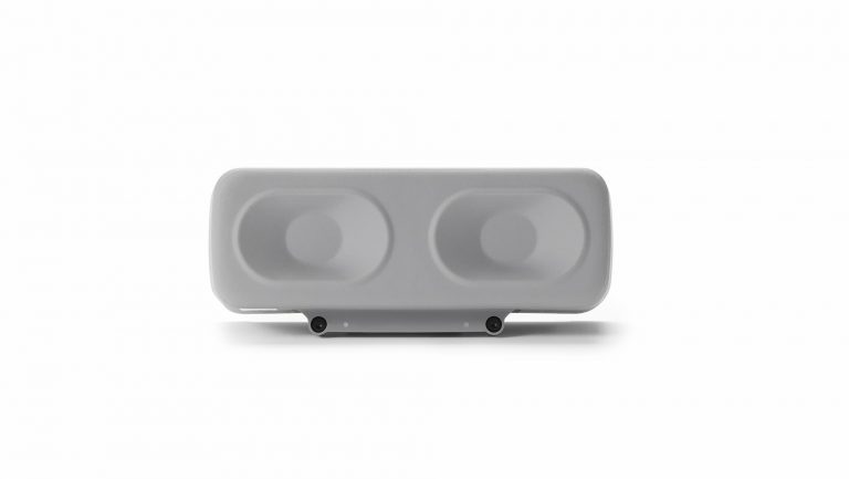 Un DJI Dock 4 rectangulaire de couleur grise, doté de deux ouvertures circulaires sur la face avant.